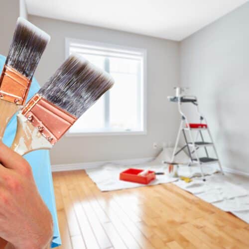 PAINT | Painter holding brushes