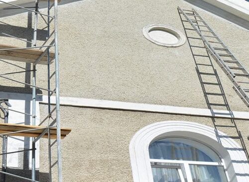 Exterior of house with scaffolding on the walls