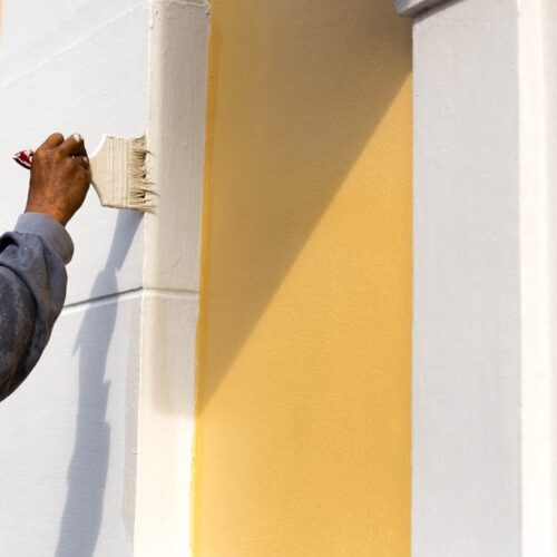 Painter painting a wall