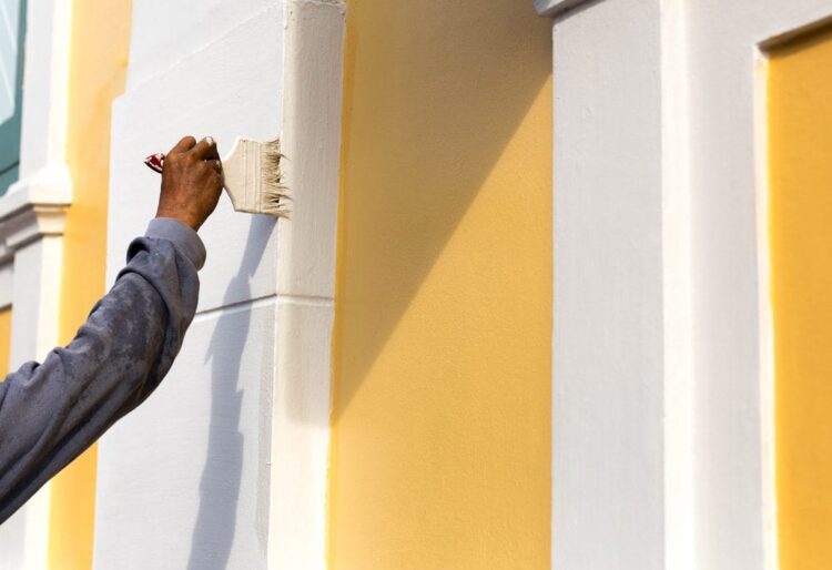 Painter painting a wall