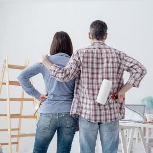 Husband and wife admiring finished paint job