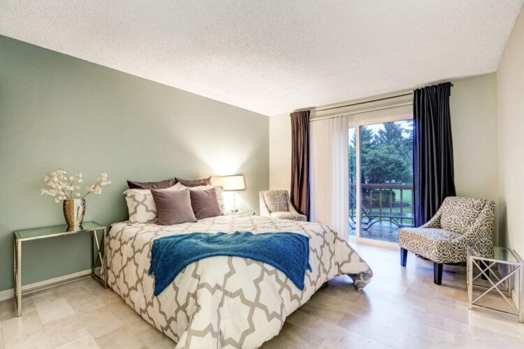 Bedroom with light green accent wall